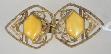 A Czech filigree belt clip clasp set with pearlized glass cabochons. Measures 7cms.