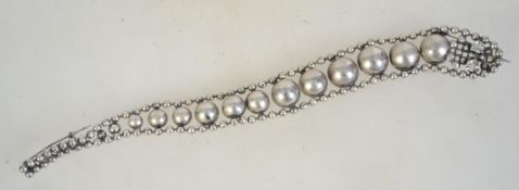 A very large 1980s silvertone and rhinestone articulated snake shoulder brooch with double pin and