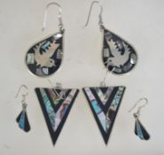 Two pairs of Alpaca white metal earrings inlaid with shell. Marked Alpaca Mexico.