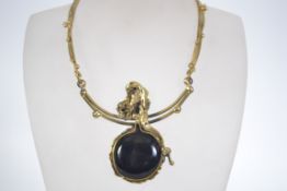 An Art Nouveau style pendant necklace with large black french jet cabochon.