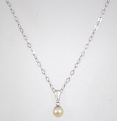 A 925 silver pendant necklace with pearl drop pendant. Measures 16 inches.