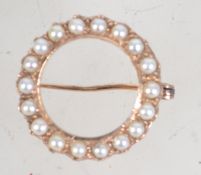 A seed pearl brooch tests as 9ct gold but unmarked. Weighs 3.8 grams.