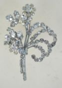 A large 1950s rhinestone spray brooch with silvertone setting and rollover catch. Measures 7.5cms.