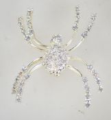 A vintage silver tone spider brooch set with clear rhinestones. Measures 6 cms.