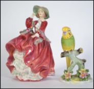 A Royal Doulton bone China figurine ' Top o the Hill ' HN1834 along with a Royal Doulton figure '