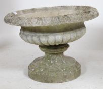 A 20th century cast stone garden urn of