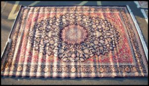 A large Iranian / Persian Keshan carpet - rug having blue ground with geometric decoration and