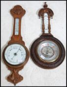 Two 20th century oak banjo barometers bo