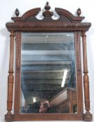 A 19th century French oak mirror having