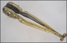A vintage brass pair of early 20th centu