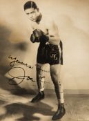A fine Joe Louis signed photograph, the 9 by 6 1/2in.