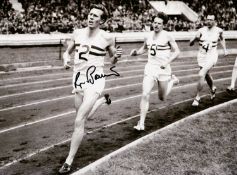 A group of four framed signed b&w photographic presentations of famous sportsmen,