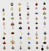 A collection of racing badges for British racecourses, mounted onto a painted hardwood panel,