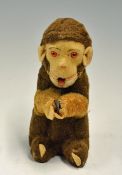 Early Clockwork Little Monkey a clockwork cheeky monkey poking its tongue in and out, nods head,