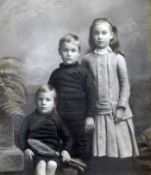 Tennis Studio photograph c.1910 - hand tinted portrait of 3x children with one holding an early play