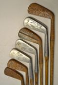 7x Assorted long irons 3x stainless including George Duncan 'Akros' model showing the Gibson star