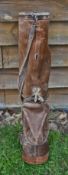 Leather circular golf bag c/w with ball pocket, shoulder strap and travel hood (small hole has