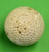 The Colonel bramble pattern golf ball showing the name to one pole and the patent number of 1906