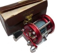 REEL: Abu Sweden Ambassadeur 6000 red multiplier reel, grooved end plates, 4 screw model, foot stamp