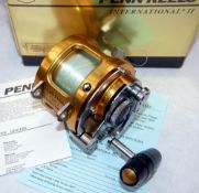 REEL: Penn International 20T multiplier reel, gold finish, lever drag with pre-set, rod saddle