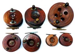 REELS: (7) Collection of 7 assorted Nottingham pattern wooden reels, a 5