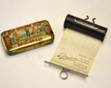 2oz Tobacco tin decorated with golfers and cross golf clubs inscribed 
