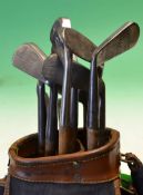 10x assorted irons and putters together in a canvas and leather golf bag, to incl a Mussel back