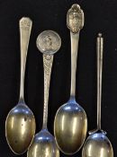 4x silver golf teaspoons - 2x decorated with period golfers, golf club stem and one engraved with 