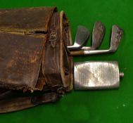 A leather golf bag with 3 x stainless irons - 2 mashies and a niblick