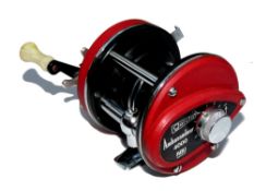 REEL: Early Abu Garcia Sweden Ambassadeur 4000 multiplier reel, red with twin white handles, foot