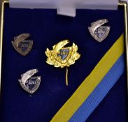 ADU PINS: Set of 4 Abu Record Fisken lapel badges, Gold with laurel leaves, silver and bronze, in