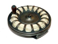 REEL: A USA built birdcage pattern white metal reel with linear foot, Billinghurst style, 3.75