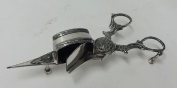 A candle snuffer indistinct marks, possibly silver with continental import mark.