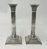 A pair of Victorian silver candle sticks of Corinthian Column design.