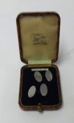 A pair of gents silver cuff links.