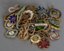 A quantity of vintage enamelled racing badges,