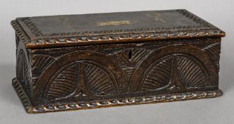 A 19th century carved oak offertory box The hinged rectangular top with coin aperture,
