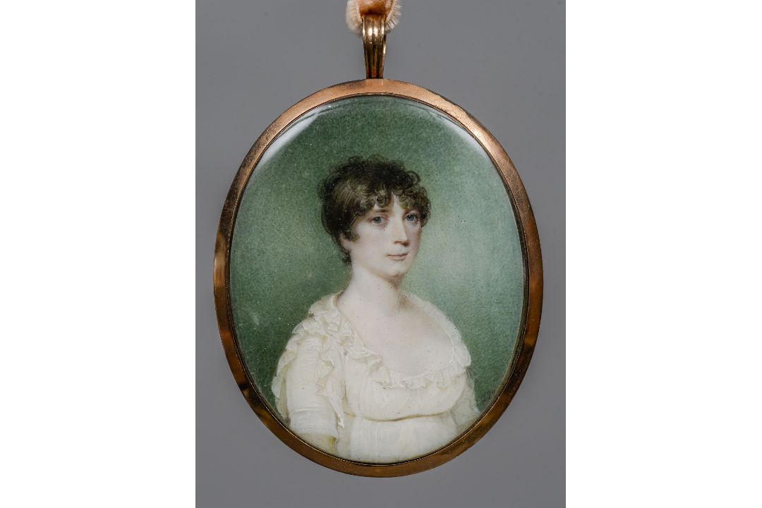 An early 19th century portrait miniature on ivory Depicting a young lady wearing a white lace dress,