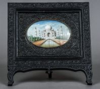 A 19th century Indian miniature on ivory depicting the Taj Mahal Set in a florally carved ebony