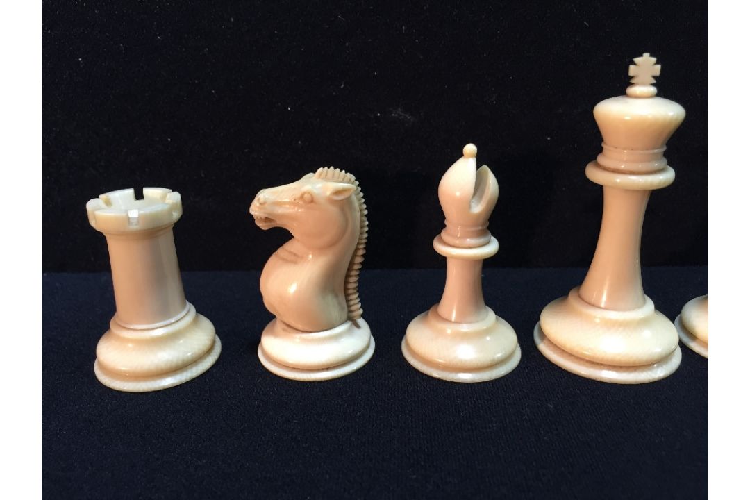 A late 19th/early 20th century carved and red stained Staunton pattern chess set In mahogany box. - Image 2 of 25