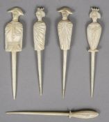 Five 19th century Napoleonic prisoner-of-war bone markers Four carved as various figures.