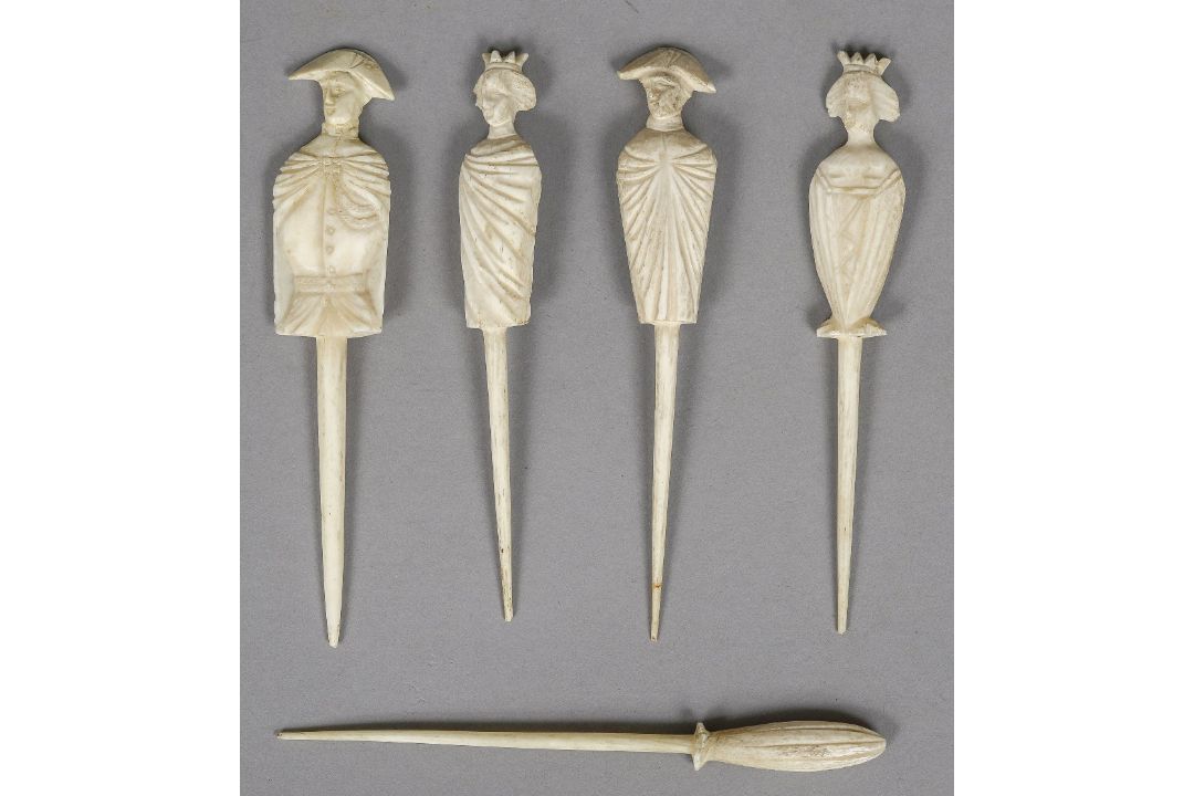 Five 19th century Napoleonic prisoner-of-war bone markers Four carved as various figures.