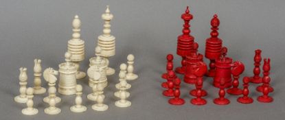 A 19th century carved bone and stained bone chess set The kings 14 cm high.