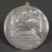 A carved mother-of-pearl shell One side decorated with the Last Supper. 14 cm wide.