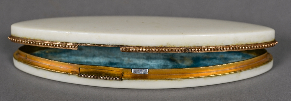 A 19th ivory patch box Of navette form, with a secret catch, the lid interior set with a mirror. 9.