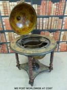 A fitted drinks/tantalus globe with hinged lid (height 98cm)