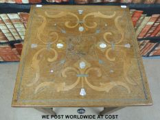 A late 19thC / 20thC mahogany table inlaid with white metal,