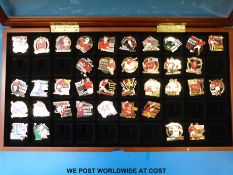 Over eighty enamel football collection badges in glass cases with certificates,
