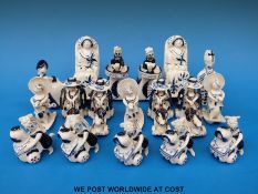Eighteen Wilfred Gibson blue and white ceramic figures including rocking horses, Craftsman Potter,