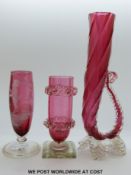 Two Victorian cranberry glasses including a Mary Gregory piece and a vase
